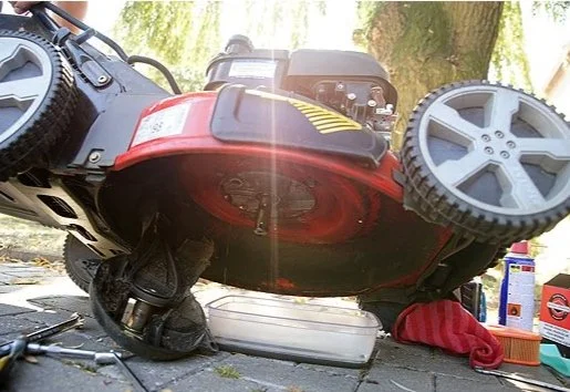 Lawn mower being serviced